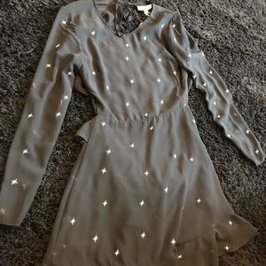 Black open back dress with ruffles and white stars